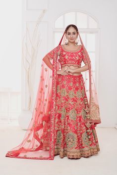 Item: Lehenga Set (Lehenga Skirt, Blouse, and 2 Dupattas) Indulge in the allure of tradition with our Crimson Mirage Lehenga. Intricately designed and hand-embroidered by our talented artisans, this lehenga captures the essence of royal splendor. With its exquisite craftsmanship and attention to detail, it promises to make you feel like royalty on your big day. Crafted in raw silk fabric, the lehenga has been meticulously handcrafted with Zardosi embroidery. The flower jaal on the lehenga is complemented with hand-embroidered elephant motifs on the hem of the lehenga. The ensemble is finished with an embroidered silk blouse with scalloping and dupatta with work done on the border to ensure that you look splendid on your big day. Our bespoke lehengas are designed with a can-can lining benea Zardosi Embroidery, Embroidered Elephant, Raw Silk Lehenga, Special Occasion Gowns, Raw Silk Fabric, Skirt Blouse, Lehenga Skirt, Red Lehenga, Silk Lehenga