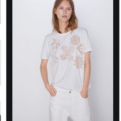 Zara White With Contrasting Beige Floral Embroidered Printed Crew Neck Short Sleeves Sweater Top Casual Spring Tops With Motif, White Crew Neck Top With Floral Embroidery, Spring Cotton Tops With Cutwork, White Summer Tops With Cutwork Hem, White Short Sleeve Top With Geometric Embroidery, Casual Cotton Tops With Cutwork Hem, Casual Cutwork Tops For Summer, White Embroidered Top With Geometric Embroidery And Short Sleeves, White Geometric Embroidered Short Sleeve Top