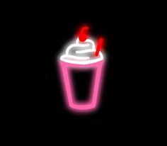 a neon cup with two straws in it on a black background, lit up by red lights