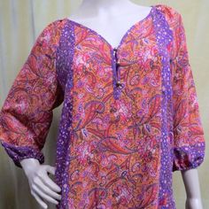 Nwt New Retail $59.00 Ladies Semi Sheer Lightweight Chiffon Pullover Boho Peasant Style Tunic Top. Purple, Orange, Pink, Hunter Green, Paisley Floral Print. Puffy Elastic Cuff 3/4 Length Sleeves, Buttoned V-Neckline. Chest Is 19" Across Front Unstretched And Length 27.5" Shoulder To Hem. Made Of 100% Polyester. Machine Washable. Spring Purple Half-sleeve Blouse, Spring Purple Half Sleeve Blouse, Summer Purple Half Sleeve Blouse, Purple Half Sleeve Tops For Spring, Paisley Print Summer Top With 3/4 Sleeves, Paisley Print 3/4 Sleeve Summer Top, Summer Paisley Print Top With 3/4 Sleeves, Casual Purple Top With Paisley Print, Summer Tops With Paisley Print And 3/4 Sleeves