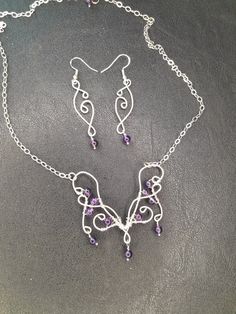 A Boho butterfly neclace in elven style for your next Renaissance fair! Made to last with .925 Sterling silver wire and Amethyst beads. The pendant is 2.25 inches wide and 2.25 inches long including the dangle on the bottom.  It's on an 18 inch chain, so the total length is about 21 inches. The dangle earrings are 2.5 inches long and 0.5 inches wide. Purple Amethyst Fantasy Jewelry, Fantasy Amethyst Silver Jewelry, Fantasy Style Silver Amethyst Jewelry, Fantasy Style Amethyst Silver Jewelry, Fantasy Style Amethyst Purple Jewelry, Fantasy Style Purple Amethyst Jewelry, Butterfly Necklace And Earrings, Elven Style, Amethyst Butterfly