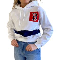 This Boston Red Sox cropped sweatshirt from Refried Apparel gives you the perfect layer to stand out on game day. The midweight fit and plush hood supply a warm and comfortable feel. Plus, this hoodie features a distinct Boston Red Sox design for an original look. Material: 50% Cotton/50% Polyester Screen print graphics Hooded Officially licensed Pullover Machine wash, tumble dry low Long sleeve Pullover Stitched fabric applique Midweight hoodie suitable for moderate temperatures Imported Fleece Winter Crew Neck Hoodie In College Style, Winter Crew Neck College Style Hoodie, Cotton College Style Sweatshirt For Winter, Casual Team-colored Hoodie For Game Day, White Cotton Hoodie For Game Day, Team-colored Crew Neck Hoodie For Winter, Casual Team-colored Hooded Hoodie, Cotton Hoodie With School Spirit Style, Cotton Hoodie For Game Day In Fall