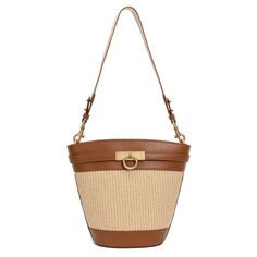 The timeless and trend-setting design of the Madison Bucket Bag is a must-have. It can be worn by its adjustable, removable shoulder strap or elegantly draped over your shoulder with an alternative woven strap. With its spacious interior, it's a wardrobe staple for your everyday adventures. Natural Bucket Bag With Detachable Strap, Everyday Natural Bucket Bag With Detachable Strap, Timeless Brown Bucket Bag With Detachable Strap, Formal Woven Leather Tote Shoulder Bag, Formal Tote Shoulder Bag With Woven Leather, Elegant Leather Straw Bag With Detachable Strap, Elegant Everyday Leather Straw Bag, Modern Natural Bucket Bag With Adjustable Strap, Chic Beige Woven Leather Bucket Bag