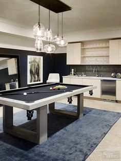 a pool table in the middle of a room