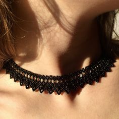 This handmade black lace choker necklace is made of the highest quality glass seeds and glass crystal beads, carefully hand-woven! It fits perfectly around your neck thanks to its stainless steel extension chain. Gothic elegant collar necklace is a beautiful collar necklace that you can use in all seasons and is compatible with all your clothes! It is a stylish handmade women's accessory for you and your loved ones! It is a black crystal goth necklace guaranteed to get all the compliments! You c Bohemian Black Crystal Necklace For Party, Handmade Crystal Choker Necklace For Party, Black Beaded Necklaces With Bead Caps As Gift, Black Bohemian Necklaces With Bead Caps, Handmade Black Crystal Necklaces For Party, Black Beaded Choker For Jewelry Making, Black Beads For Jewelry Making Choker, Bohemian Black Necklaces With Bead Caps, Handmade Adjustable Crystal Necklaces For Party