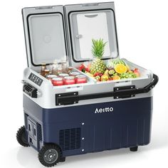 an open cooler with drinks and fruit inside on a white backgroung background