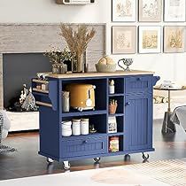 a living room with a blue cabinet and pictures on the wall above it, in front of a fireplace