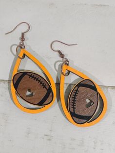 Show your Pride for Tennessee football on game day by wearing your VOLS jewelry. These are very lightweight, you won't even know you're wearing them. Do you have football fan on your Christmas list? Check them off the list with this gift.  Go VOLS handpainted orange walnut wood earrings.  🏈Tennessee football  🏈Volunteers jewelry  🏈Game day Football Earrings, Go Vols, Tennessee Football, Football Gifts, Wood Earrings, Christmas List, Walnut Wood, Newport, Game Day