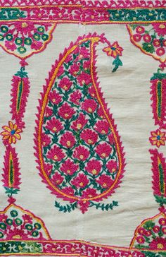 This is an antique Surat area embroidery from Gujarat, Indian in sumptuous green and pink dyed silk. The pink silk is cochineal and the green is from a combination of indigo and a yellow bearing plant. The design is in a beautiful boteh design filled with small flowers and framed by long serrated leaves forming a column between each boteh. It was probably made as a shawl with the boteh, or paisley, designs being on the end of the shawl or a hanging in and of itself with two pieces joined togethe Embroidered Pink Raw Silk Traditional Wear, Pink Embroidered Raw Silk Traditional Wear, Pink Raw Silk Embroidered Fabric In Traditional Drape, Pink Raw Silk Embroidered Fabric With Traditional Drape, Pink Raw Silk Fabric With Traditional Drape, Transitional Pink Chanderi Embroidered Fabric, Pink Bohemian Traditional Wear With Resham Embroidery, Bohemian Style Pink Traditional Wear For Festivals, Pink Bohemian Traditional Wear For Festival