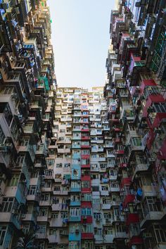 many balconies and windows in an apartment building