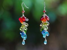 "THE JEWELRY IS SHIPPED via DHL EXPRESS (2-5 days delivery door to door). THE DHL SHIPPING COST IS INCLUDED IN THE PRICE. The Story Earrings - Multi Gemstone Rainbow Earrings, Long Gemstone Cluster Earrings in Sterling Silver ► Measurements / Details: - Length including earwire: 2.56\" (~6.5 cm) * can be made longer/shorter per request - Silver: High quality Sterling Silver - Gold: High quality 14K Gold Filled ► Gemstones: The earrings include excellent AAA quality gemstones, they are natural, s Rainbow Color Palette, Gemstone Earrings Dangle, Rainbow Gemstones, Rainbow Jewelry, Carnelian Beads, Rainbow Earrings, Semi Precious Stone, Green Peridot, Colorful Earrings