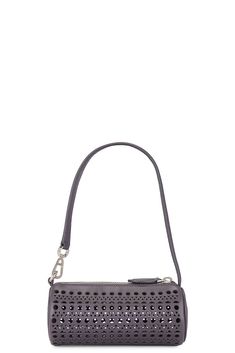 Find ALAÏA Mini Tube Bag In Grey on Editorialist. ALAÏA Mini Tube Bag in Grey Calfskin leather exterior with lambskin lining. Made in Italy. Top zipper closure. One main compartment. Vienne pattern inspired by precious lace and moucharabieh architectural openwork. Leather shoulder strap. Measures approx 6 W x 2.5 H x 2.5 D Shoulder strap with a 6.5 drop. ALIA-WY114. AA1P042CA262. About the designer: The late Azzedine Alaïa had a comprehensive understanding of the female form, thanks to an education in sculpture from École des Beaux-Arts. Revered for his bodycon silhouettes that defined the aesthetic of Paris in the ‘80s, the Tunisian designer was also known for his intricate footwear, statement bags and laser-cut accessories. Statement Bags, Azzedine Alaïa, Azzedine Alaia, Mini Bucket Bags, Mini Bucket, Statement Bag, Pink Bag, Leather Top, Bag Pattern