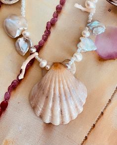 Beach Pearl Pendant Necklace, Beach Pearl Necklace With Pearl Pendant, Pearl Pendant Necklace For Beach, Ocean-inspired Necklaces With Pearl Charm For Beach, Ocean-inspired Pearl Charm Jewelry For Beach, Ocean-inspired Pearl Charm Necklaces For Beach, Ocean-inspired Beach Necklaces With Pearl Charm, Bohemian Pearl Pendant Necklace For Beach, Pearl Shell Necklace With Pearl Pendant For Beach