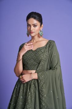 Make a statement in this 3-piece Green Diamond Georgette Thread & Sequins Embroidered Lehenga Choli Set, featuring a floor-length lehenga with 4 meters of flair, a Sweetheart Neck blouse, and a 2.30-meter Dupatta. The no-fuss outfit comes semi-stitched with a standard cancan and canvas attached; plus, customizations are available upon request. Dry Clean only and rock on, fashionista! No of Set - 3-piece set Color- Green Blouse Fabric - Diamond Georgette Blouse Sleeves-Regular Sleeves Size - 1 Me Semi-stitched Georgette Sets With Zari Work, Embroidered Sets For Diwali Reception, Bollywood Semi-stitched Saree Sets, Bollywood Style Semi-stitched Saree Sets, Bollywood Embroidered Sets For Reception, Bollywood Style Embroidered Reception Sets, Designer Wear Embroidered Fitted Sets, Fitted Georgette Sets With Zari Work, Designer Embroidered Fitted Sets