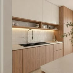 a kitchen with wooden cabinets and white counter tops