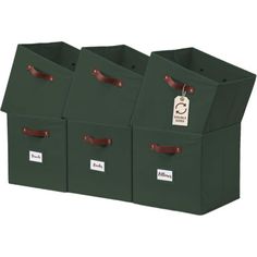 three green storage bins with brown handles