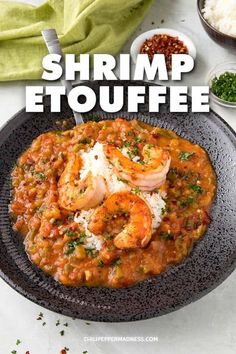 shrimp etouffe on a plate with rice and garnish