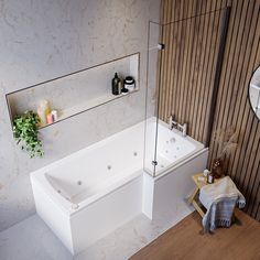 a white bath tub sitting next to a wooden wall with shelves on it's sides