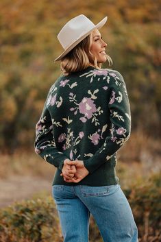 Get ready to embrace the fall and winter season in style with our Evelyn Floral Knit Sweater! This deep green sweater is not only cute but also incredibly cozy, perfect for staying warm on chilly days. The floral design adds a playful touch, making it a must-have for any fashion-forward individual. Paired with THE MIMI COWGIRL BOOTS IN WHITE , THE SAYLOR WIDE LEG JEANS IN MEDIUM DENIM Long sleeve Round neck Ribbed on neck Floral print 52% acrylic, 25% nylon, 23% polyester Relaxed fit. Small (0-4 Green Winter Sweater For Cold Weather, Green Sweater For Winter Cold Weather, Green Soft Knit Winter Sweater, Green Soft Knit Sweater For Winter, Winter Green Knit Sweater, Green Knit Winter Sweater, Green Knit Sweater For Winter, Trendy Green Fall Sweater, Trendy Green Soft Knit Sweater