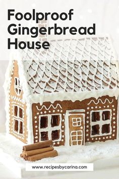 a gingerbread house with cinnamon sticks and icing on the roof is featured in this recipe