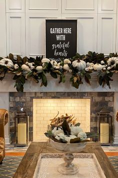 a living room filled with furniture and a fire place in front of a mantel