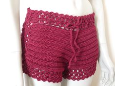 Crochet women shorts, summer crochet shorts. Crochet woman shorts, woman crochet shorts, crochet beach shorts, crochet woman cover-up, gift for her. Crochet shorts hand-made with 100% Italian cotton yarn( wine red color). The shorts fit well to an Italian size 42 or higher based on the fit.  The mannequin on which the shorts are worn is a size 42 ITA  We recommend hand washing with soap for delicates, after washing, wrap the garment in a dry towel to remove excess water, let it dry horizontally. Beachwear Shorts With Crochet Trim, Crochet Shorts For Beach Season, Crochet Beach Shorts For Beach Season, Beach Season Crochet Shorts, Beachwear Shorts With Crochet Trim For Vacation, Crochet Shorts For Spring Vacation, Crochet Shorts For Vacation In Spring, Vacation Beach Shorts With Crochet Trim, Vacation Shorts With Crochet Trim For Beach Season