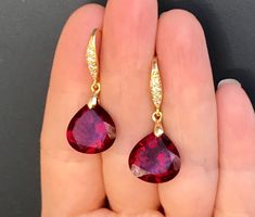 "Burgundy Garnet gold pave earrings. Heart cut garnets. Red stone jewelry. Red garnet dangles. Dark red garnet drops. Junuary birthstone. Available in 3 finishes. Length 1 1/4\". Dark red faceted gems are 14x14 mm as photo are sold, 19x14 mm and 13x17 mm stones are available. These beautiful earrings will arrive in a jewelry box ready for gift giving." Ruby Gemstone Earrings As Gift, Lab-created Ruby Gemstone Earrings As Gift, Lab-created Ruby Gemstone Earrings For Gift, Red Faceted Garnet Earrings, Red Garnet Drop Jewelry, Red Faceted Earrings For Anniversary, Red Garnet Drop Earrings, Red Stone Jewelry, Pave Earrings