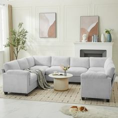 a living room filled with furniture and a fire place