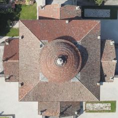 an aerial view of the roof of a house with a circular design on it's top