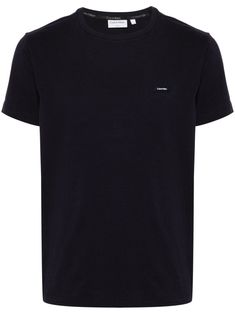 midnight blue cotton blend jersey texture crew neck short sleeves appliqué logo at the chest straight hem Calvin Klein Logo Print Crew Neck T-shirt, Calvin Klein Crew Neck T-shirt With Logo, Calvin Klein Cotton Logo T-shirt, Calvin Klein Cotton T-shirt With Logo Print, Blue Crew Neck T-shirt With Logo Detail, Classic Calvin Klein Short Sleeve T-shirt, Casual Blue T-shirt With Logo Detail, Classic Calvin Klein Crew Neck Top, Classic Short Sleeve T-shirt With Logo Patch