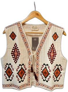 Bohemian Cotton Outerwear With Geometric Embroidery, Bohemian Embroidered Cotton Outerwear, Fall Embroidered Cotton Vest, Fall Cotton Embroidered Vest, Cotton Outerwear With Geometric Embroidery For Fall, Folk Style Cotton Outerwear With Geometric Embroidery, Cotton Vest With Multicolor Embroidery, Hippie Embroidered Outerwear For Fall, Hippie Embroidered Fall Outerwear