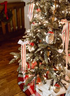 a small christmas tree with ornaments on it