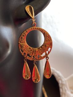 These are stamped, lightweight, gold Vermeil earrings. They are a wonderful, ethnic design. The earrings are unique, and comfortable to wear., They are 2 1/2 inches long, and 1 1/8 inches wide. Gold Bohemian Clip-on Earrings, Gold Teardrop Vintage Chandelier Earrings, Vintage Gold Teardrop Chandelier Earrings, Bohemian Gold Pierced Danglers, Gold Dangle Clip-on Earrings With Latkans, Gold Teardrop Chandelier Earrings For Festivals, Vintage Gold Pierced Danglers, Gold Vintage Danglers With Latkans, Gold Vintage Danglers