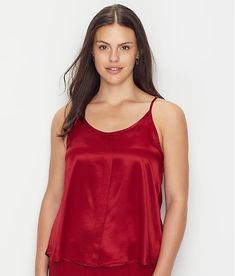 Our favorite lounge line truly has something for everything. Their mix-and-match line of satiny basics feels special and luxurious; we think it’s the next best thing to silk and it’s wash-and-wear! This racerback camisole has adjustable straps and a swingy silhouette-- you’ll never want to take it off. The lipstick red Babe tank top runs large. Order one size smaller than you typically would. To best care for your garments, we recommend hand washing them with a gentle weighted detergent like Soa Solid Satin Camisole, Satin Camisole With Built-in Bra For Loungewear, Satin Cami Tank Top With Adjustable Straps, Satin Camisole Tank Top With Adjustable Straps, Casual Satin Camisole, Solid Satin Camisole For Loungewear, Chic Satin Loungewear Tops, Summer Satin Loungewear Tops, Summer Satin Tops For Loungewear