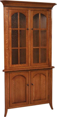 a wooden china cabinet with glass doors on the front and side panels, in an oak finish