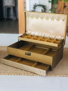 an open jewelry box sitting on top of a table