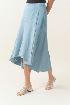 This flattering skirt is expertly cut to fall and flow gently. It's a pull-on style that cleverly gives you the look of a wrap skirt. Pair it with our Draped Vest for one-and-done elegance; or don a classic cotton shirt on top. Pull-on with fully elasticated waist. Slightly longer in the back. Crafted from a soft and sustainable Bamboo-Cotton jersey Machine washable Modest Bottoms For Day Out, Spring Rayon Maxi Skirt With Gathered Details, Modest Relaxed Tiered Skirt, Modest Tiered Skirt, Relaxed Ruffled Maxi Skirt For Day Out, Relaxed Fit Midi Skirt For Daywear, Flowy Rayon Lined Skirt, Chic Tulle Maxi Skirt, Rayon Lined Skirt Bottoms For Daywear