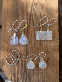 These are a handmade pairs  of  square or dangle drop smooth  eye catching Opalescent Moonstone  earrings. They are available with either fishhook or leverbacks. The many colors include shades of  aurora borealis  of green and blue. The stone itself is approximately   one inch from earlobe. Moonstone Earrings, Wedding Jewelry Earrings, One Inch, Green And Blue, Fish Hook, Aurora Borealis, Wedding Earrings, Moonstone, Wedding Jewelry