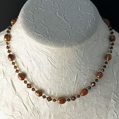 New Handmade Necklace Is Made Of Copper Brown Rice Pearls, Swarovski Smoky Topaz Crystals In Graduated Sizes, Silver-Lined Delica Seed Beads, A Silver-Plated Hook And Eye Clasp With An Extender. This Necklace Measures 16" Long And Has A 2-1/2" Extender. It Is Very Vintage Boho. * This Is A One-Of-A-Kind Necklace. * There May Be Some Color Discrepancies Due To Different Monitor Settings. The Colors Are Described As Clearly And Genuinely As Possible. * All Items Are Created In A Smoke-Free And Pet Elegant Brown Faceted Necklace, Gold Necklace With Crystal And Gemstone Beads, Beaded Round Necklace For Anniversary, Brown Spacer Beads Jewelry Gift, Brown Faceted Jewelry Gift, Round Beaded Anniversary Necklace, Elegant Brown Necklace For Anniversary, Crystal Necklace With Spacer Beads For Gift, Elegant Brown Crystal Necklace With Gemstone Beads