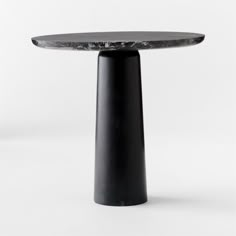 a black table with a marble top on a white background