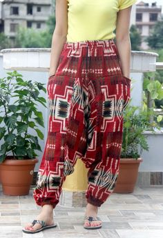 This Aztec Woolen Yoga Trouser or pant is warm and cozy, made from high-quality Acrylic Fibre. It is perfect for Winter. It has a comfortable elastic waist, and one size fits most. It is perfect for Holidays, Nightwear, Cool Winter Days, and Travel. Features: Spacious Loose-fitting Versatile Super comfortable Durable Easy to wear Place of Origin: Nepal MOQ: 10 pcs Note: For bulk order, we can customize the size and manufacture it in bulk with your own brand. Contact us. Casual Harem Yoga Pants, Casual Winter Yoga Pants, Red Non-stretch Casual Harem Pants, Red Casual Harem Pants For Loungewear, Casual Red Harem Pants For Loungewear, Traditional Cotton Lounge Pants, Traditional Cotton Pants For Loungewear, Casual Harem Yoga Pants With Pockets, Casual Red Cotton Harem Pants