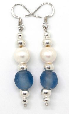 "Freshwater pearls and cobalt or frost blue beach glass highlight these dazzling dangle earrings. Eco-friendly recycled glass, handmade in Ghana. Resort jewelry. These earrings coordinate with the lariat necklace and bracelet, found here: https://www.etsy.com/listing/270102727/tribal-sea-28-leather-lariat-necklace https://www.etsy.com/listing/453623328/pearls-beach-glass-beaded-leather Earrings include stainless steel fishhook wires, and hang 1.75\" long from the bottom of the ear wire. Cobalt o Czech Beads Jewelry, Resort Jewelry, Beading Earrings, Souvenir Jewelry, Dangle Earrings Silver, Blue Cobalt, Earring Making, Beaded Earrings Patterns, Beading Ideas