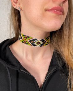 Unisex choker with native American designs . Made from Czech beads. Length 12.2 inches (31 cm)+Chain extension 2 inches (5cm) Width 1,1 inches (3 cm)  >Back to my shop: https://www.etsy.com/shop/jewelrybylarisa?ref=seller-platform-mcnav Green Beaded Choker For Festivals, Unique Tiny Beads Choker Jewelry, Unique Beaded Choker Jewelry, Handmade Adjustable Beaded Choker, Yellow Beaded Choker For Festivals, Traditional Adjustable Beaded Choker Necklace, Southwestern Handwoven Jewelry For Festivals, Adjustable Beaded Choker For Festival, Traditional Adjustable Beaded Choker