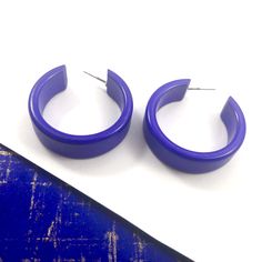 Cobalt Blue opaque lucite hoop earrings in a straight & sturdy shape with a shiny cobalt finish anda purple hue. This style is known as the 'Chandler Hoop' (formerly known as the Small Portland Hoop) and comes in 2 sizes. The larger one is the Portland Hoop. This is the smaller of the 2, but is in no way a small hoop. It measures about 30mm or 1.25" in diameter & 10mm in width. One of our favorite styles & comes in many colors. Jewelry is designed & hand finished by us, here in t Modern Small Hoop Earrings In Plastic, Modern Plastic Hoop Earrings, Modern Small Hoop Plastic Jewelry, Modern Plastic Hoop Jewelry, Trendy Plastic Hoop Earrings, Modern Small Hoop Plastic Earrings, Modern Plastic Hoop Earrings For Gifts, Modern Plastic Hoop Earrings As Gift, Modern Lucite Hoop Earrings