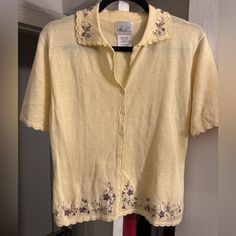 Pastel Yellow Short Sleeve Sweater With Embroidered Flowers. Also Has A Pretty Scalloped Trim. Vintage, But New Condition. Casual Yellow Embroidered Tops, Yellow Embroidered Tops For Fall, Fitted Yellow Tops With Floral Embroidery, Fitted Embroidered Yellow Tops, Fitted Yellow Embroidered Tops, Taupe Cardigan, Rose Cardigan, Yellow Short, Yellow Outfit