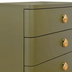 an olive green dresser with gold handles and knobs