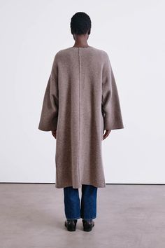 A woven wool and cashmere blend coat with open front, bell sleeves, and blanket stitch detail along the pockets and collar. 90% Wool, 10% Cashmere. 24.5" Bust, 17.5" Sleeve, 28.5" Bottom Width, 44.25" Total Length. One size: Fits sizes XS-XL. Dry clean only. Woven in Inner Mongolia. Inner Mongolia, Knitwear Dress, Blanket Stitch, Cashmere Coat, Mongolia, Cashmere Scarf, Toe Rings, Bell Sleeves, Ready To Wear