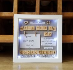 a photo frame with scrabbles and words written on it