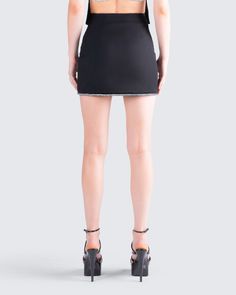 Unleash your allure in sophistication and sparkle ✨ Crafted from stretch suiting fabric, this black rhinestone mini skirt features a fully lined design and an exquisite rhinestone hem trim for an extra touch of glamour 🖤 Night Out Mini Skort In Elastane, Elastane Mini Skirt Skort For Night Out, Elastane Mini Skort For Night Out, Night Out Elastane Mini Skirt, Glamorous Black Mini Skirt For Formal Occasions, Glamorous Black Formal Mini Skirt, Glamorous Fitted Mini Skirt For Formal Occasions, Fitted Bottoms For Night Out With Mini Hem, Party Mini Bottoms Made Of Elastane