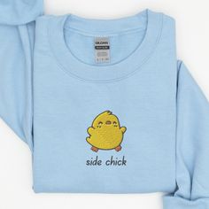 Side Chick Sweatshirt, Embroidered Baby Chick Crewneck Sweatshirt, Cute Chick Shirt, Funny Sweatshirt, Funny Embroidered Shirt This embroidered side chick crewneck sweatshirt is everything. Perfect to tell everyone your personal business. Please let me know if you would like extended sizing (3X-5X), I have certain color and size options available! ✨ 50% cotton, 50% polyester ✨ Pre-shrunk ✨ Classic fit Care: Machine wash: warm (max 40C or 105F) Tumble dry: low Do not iron directly on the print About me: My name is Sarah and I am a graduate student and music teacher! I run this small business myself and enjoy creating fun designs in my free time for some extra cash. I hope that you enjoy these designs as gifts for others or even yourself! REFUNDS AND EXCHANGES All items are made to order usi Chick Shirt, Side Chick, Personal Business, Baby Chick, Animal Sweatshirt, Sweatshirt Cute, Baby Chicks, Funny Sweatshirts, Business Person